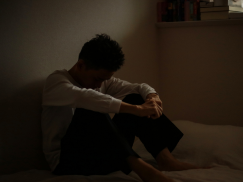 A young man experiences greening out.