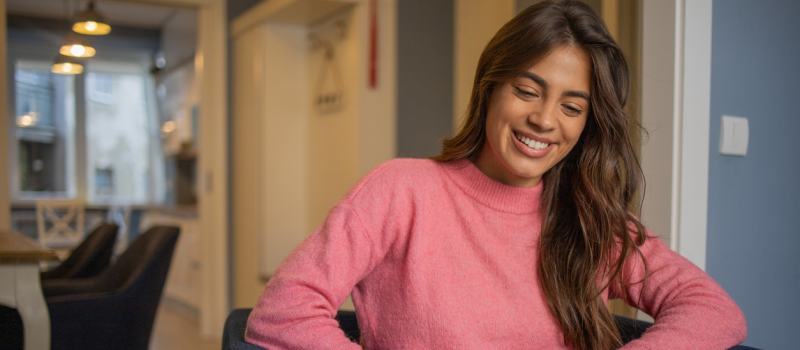 A young woman works with a mental health professional.