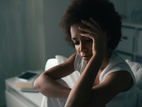 A young woman is experiencing the effects of complex PTSD.