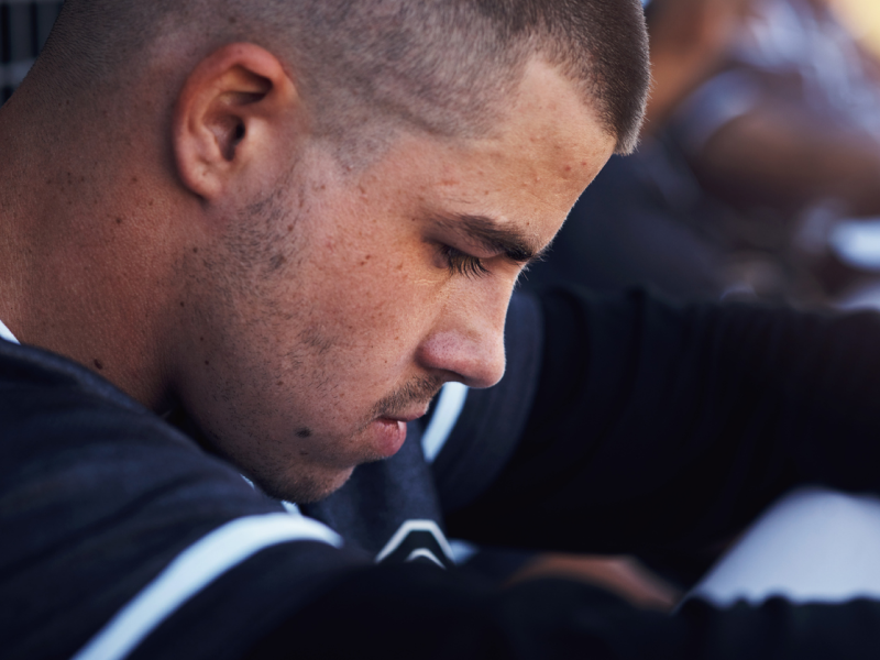A young man experiences mental health struggles as an athlete.