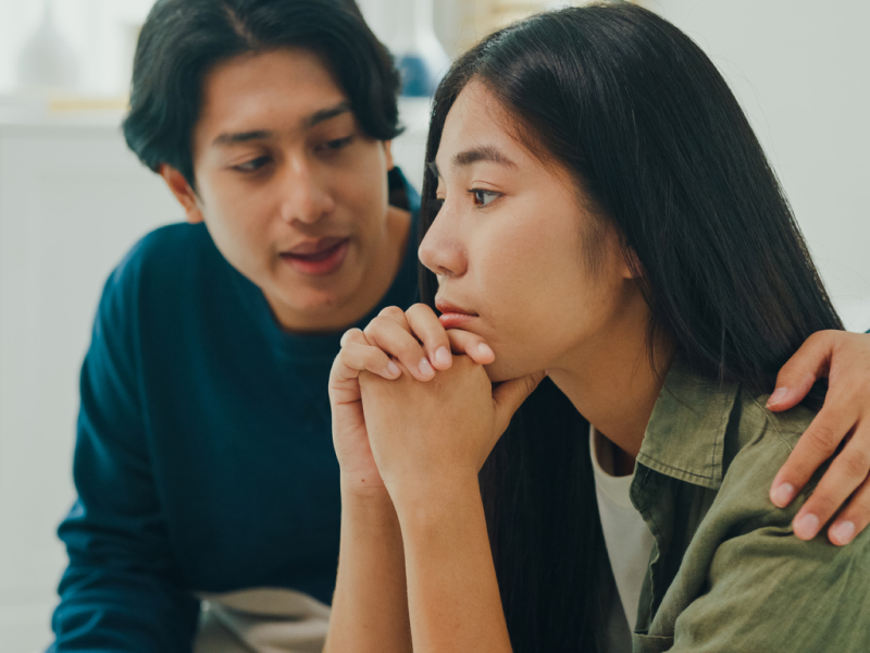 A woman who feels like everyone hates her is being comforted by her friend.