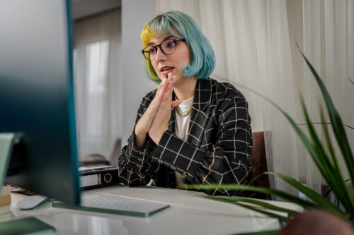 Psychotherapist having online group therapy session with patient