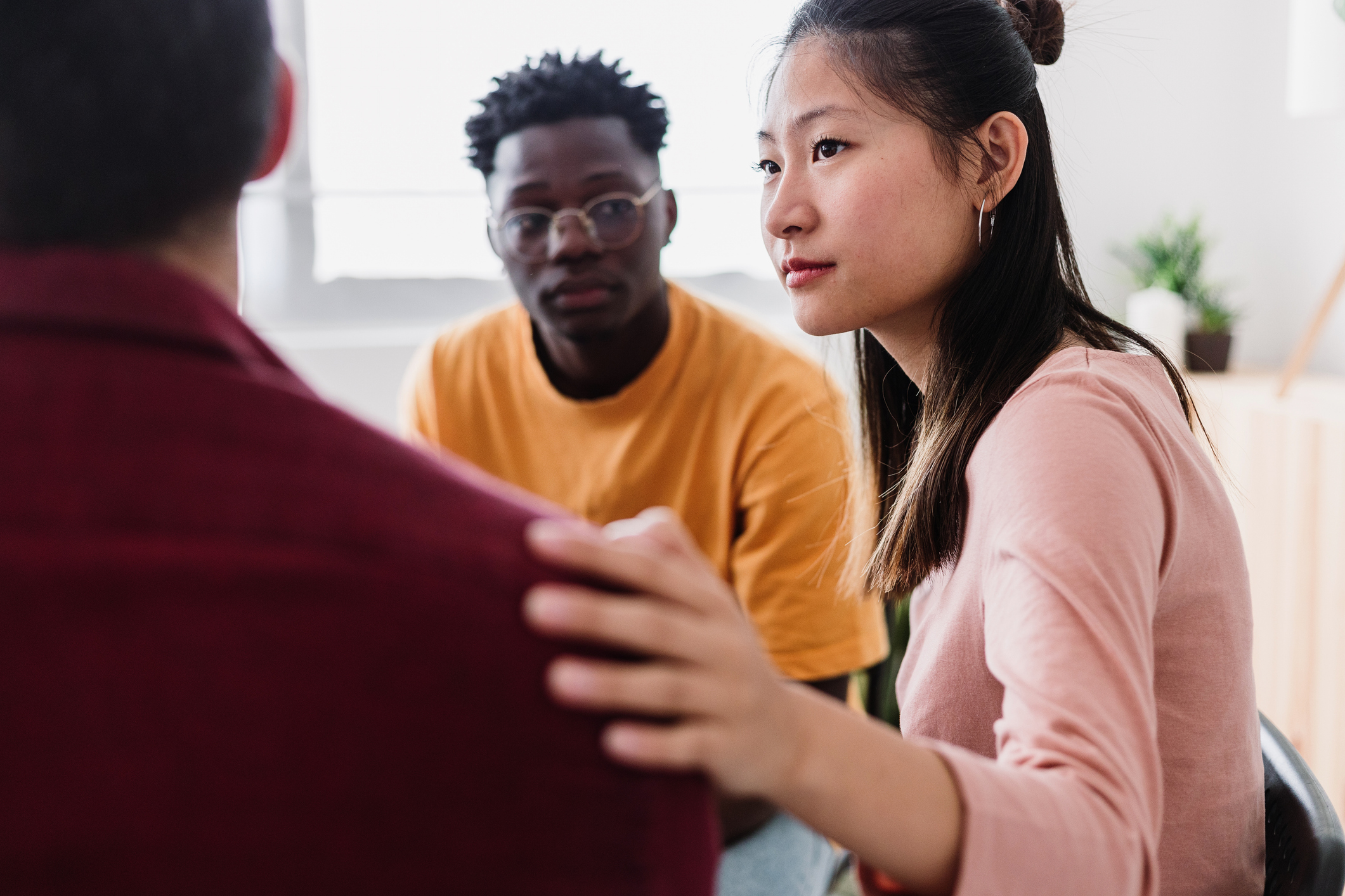 Meeting of young people in group therapy supporting each other through PTSD and anger.