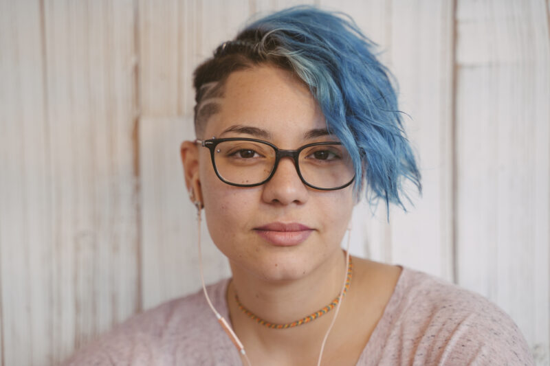 portrait of a young woman learning about the difference between her type of therapy options