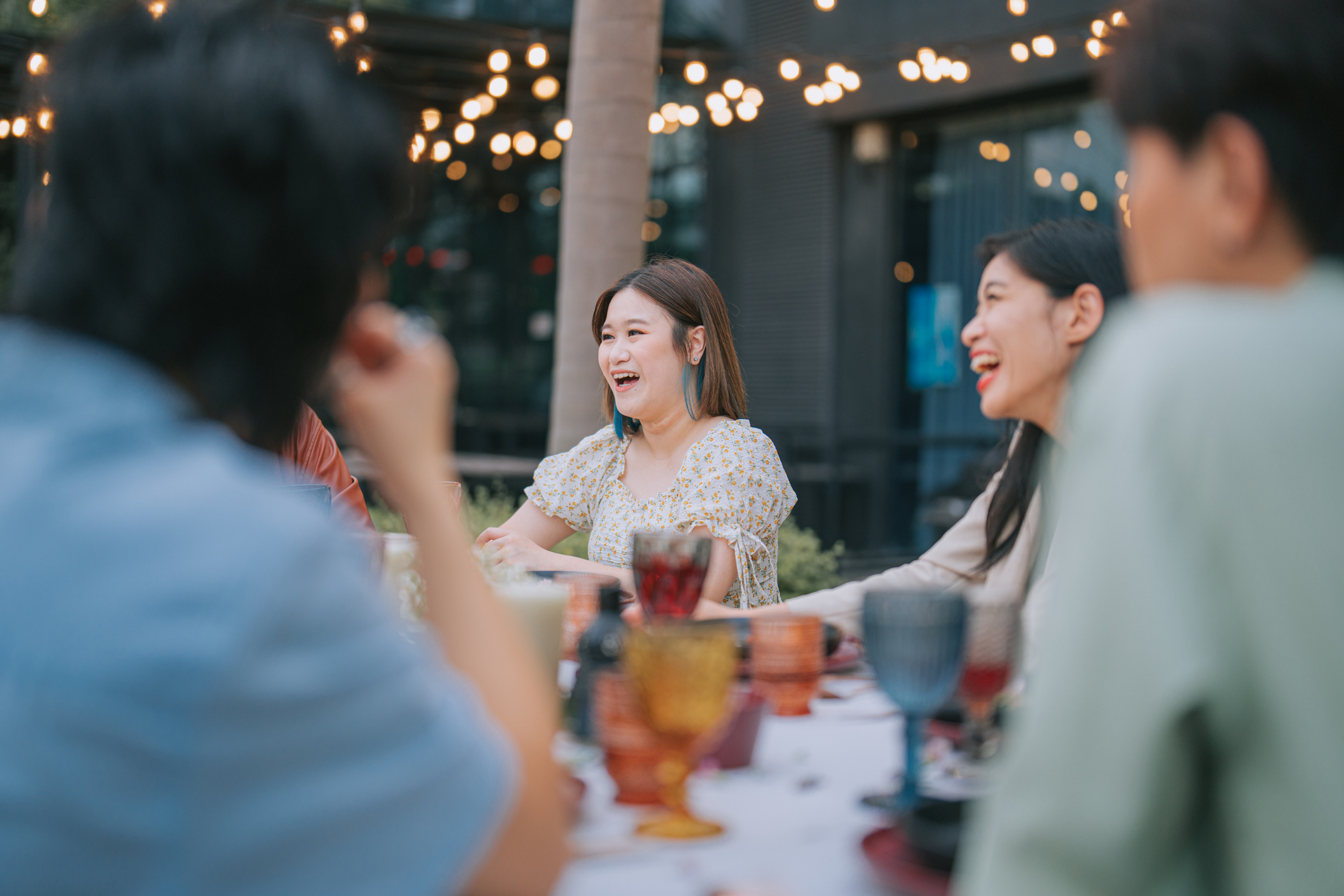 Asian Chinese Friends enjoying Outdoor Dining Social Gathering feeling like themselves