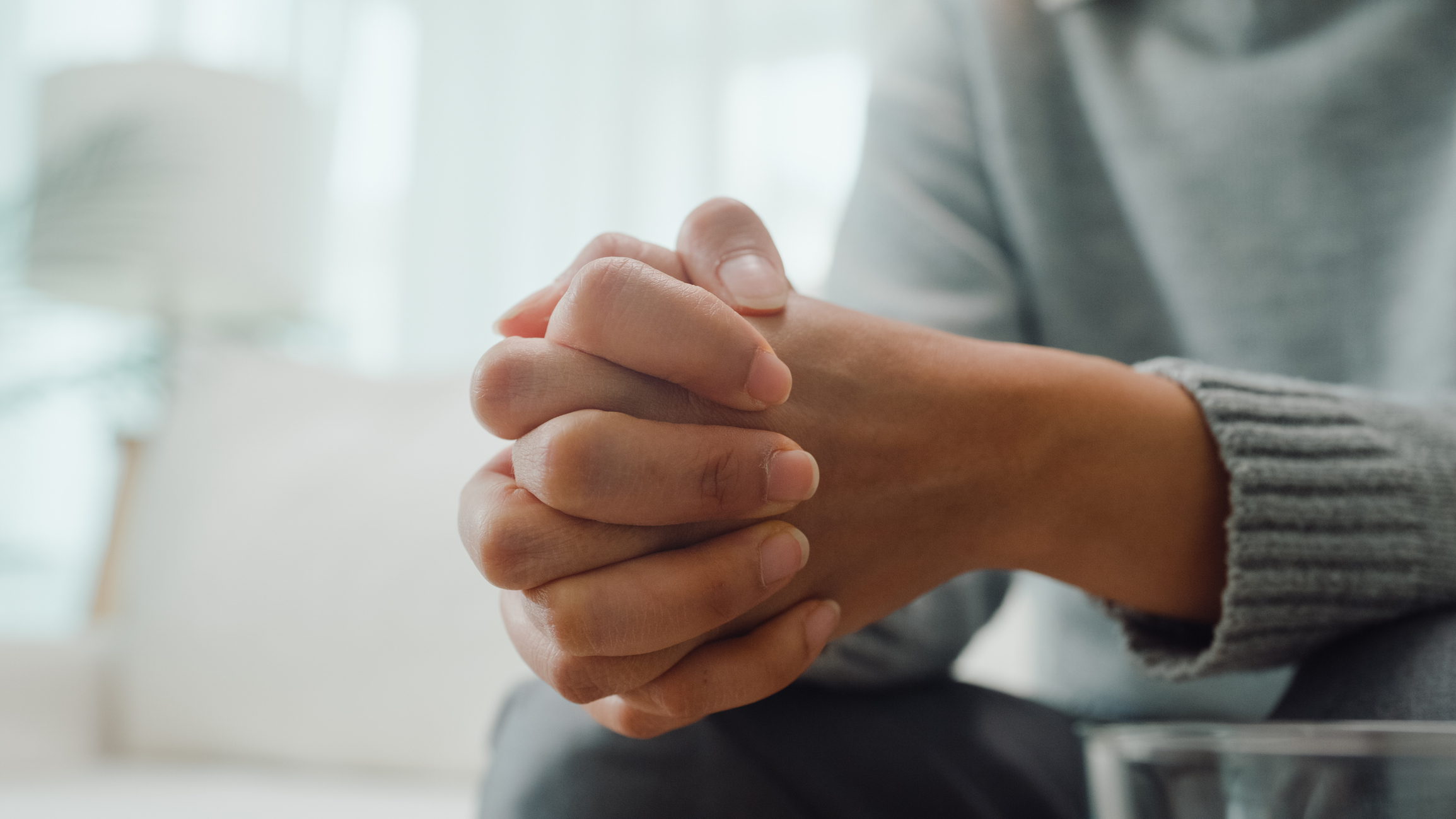 Close up of hands in a position of listening and caring