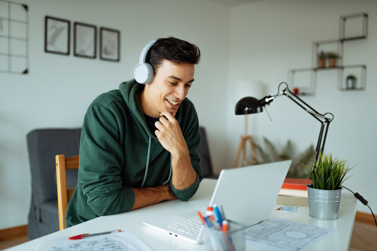 Young neurodivergent man attending virtual therapy.