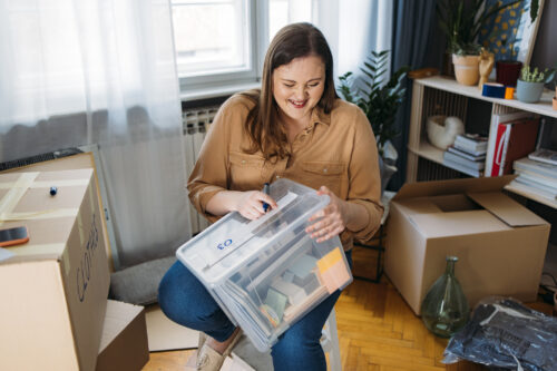 Woman happy to be organizing and getting rid of items