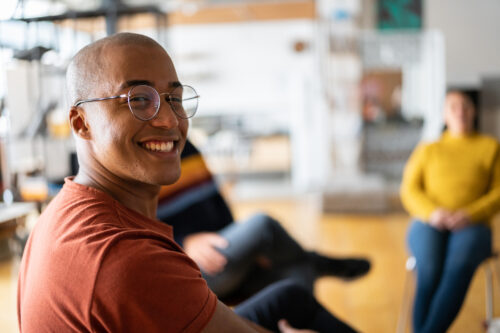 Individual feeling uplifted from the support he receives in his group therapy talking about his ADHD