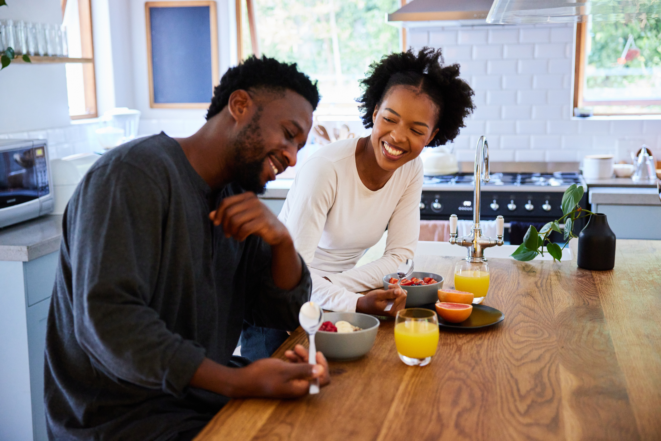 Couple happy and laughing as their relationship has gotten to a healthy place