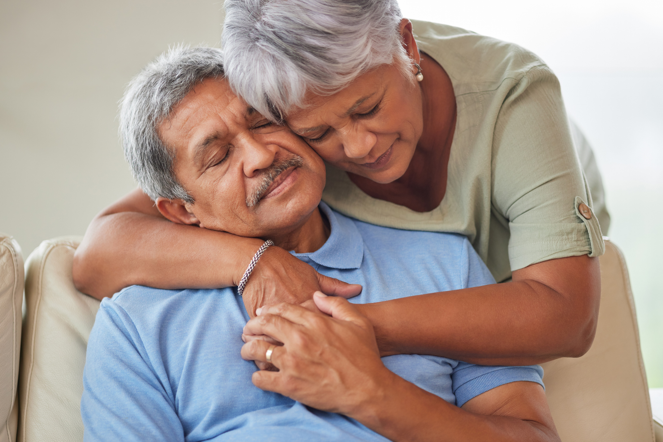 Husband and wife supporting each other as they process their grief and try to overcome their depression.