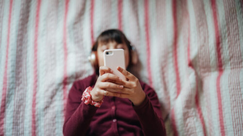 Teenager glued to her phone