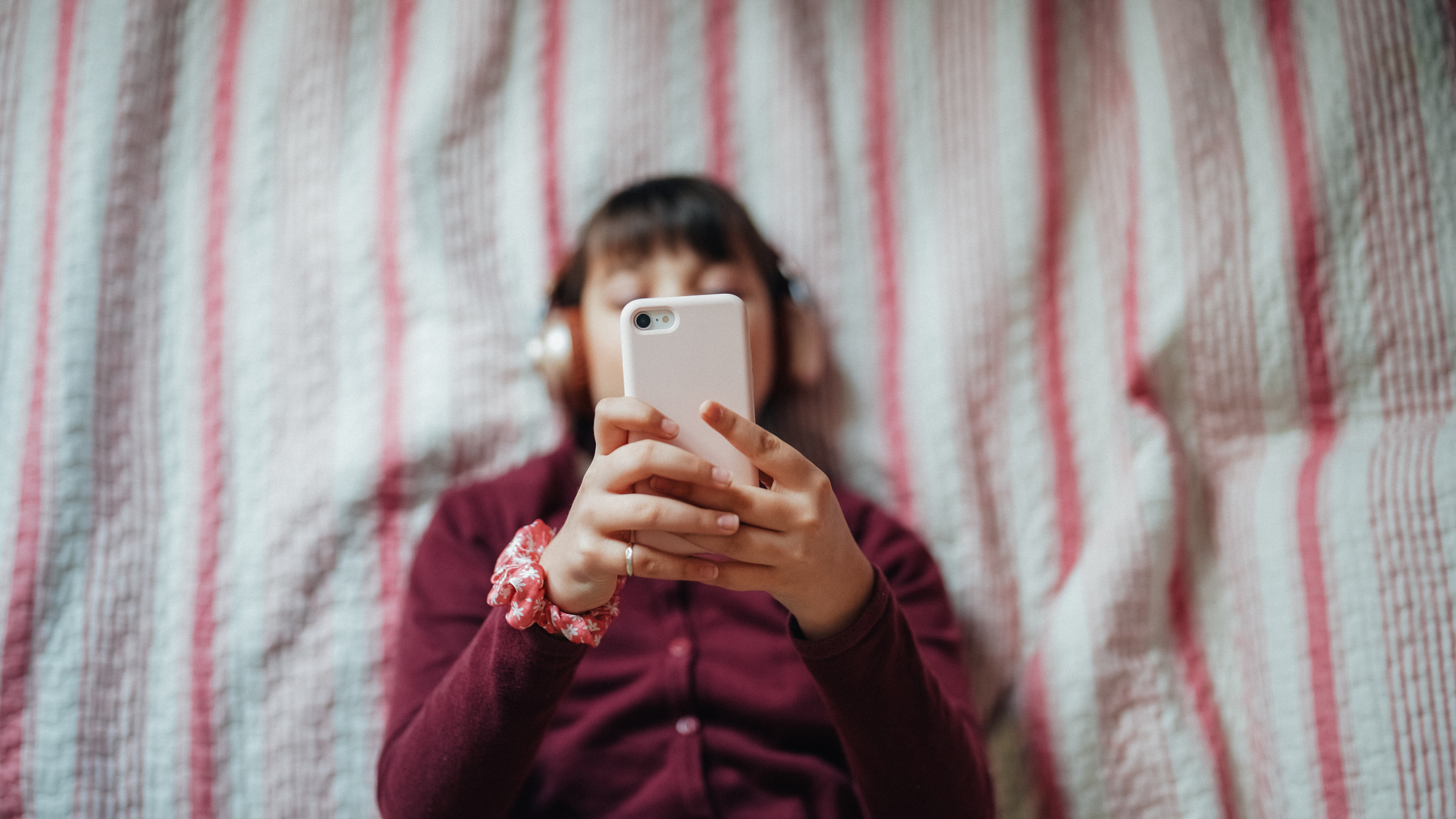 Teenager glued to her phone