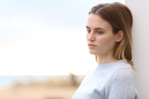 Woman feeling worried and trying to understand the difference between psychopath and sociopath.