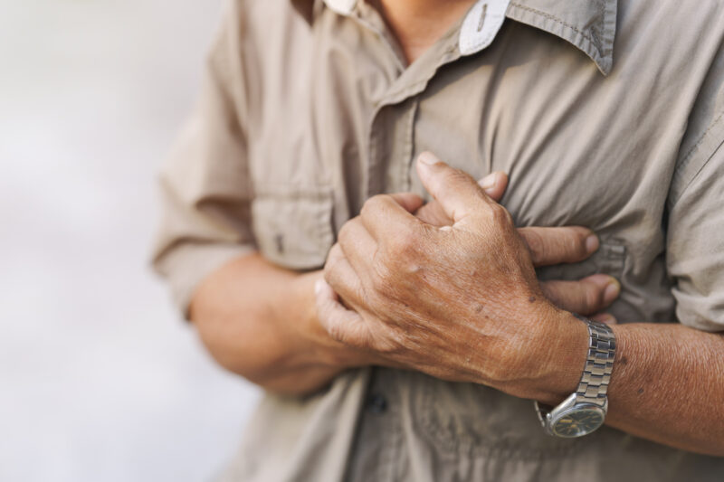 Man clutching his chest in pain.