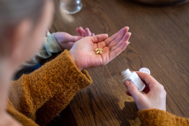 Woman holding her ADHD medication.