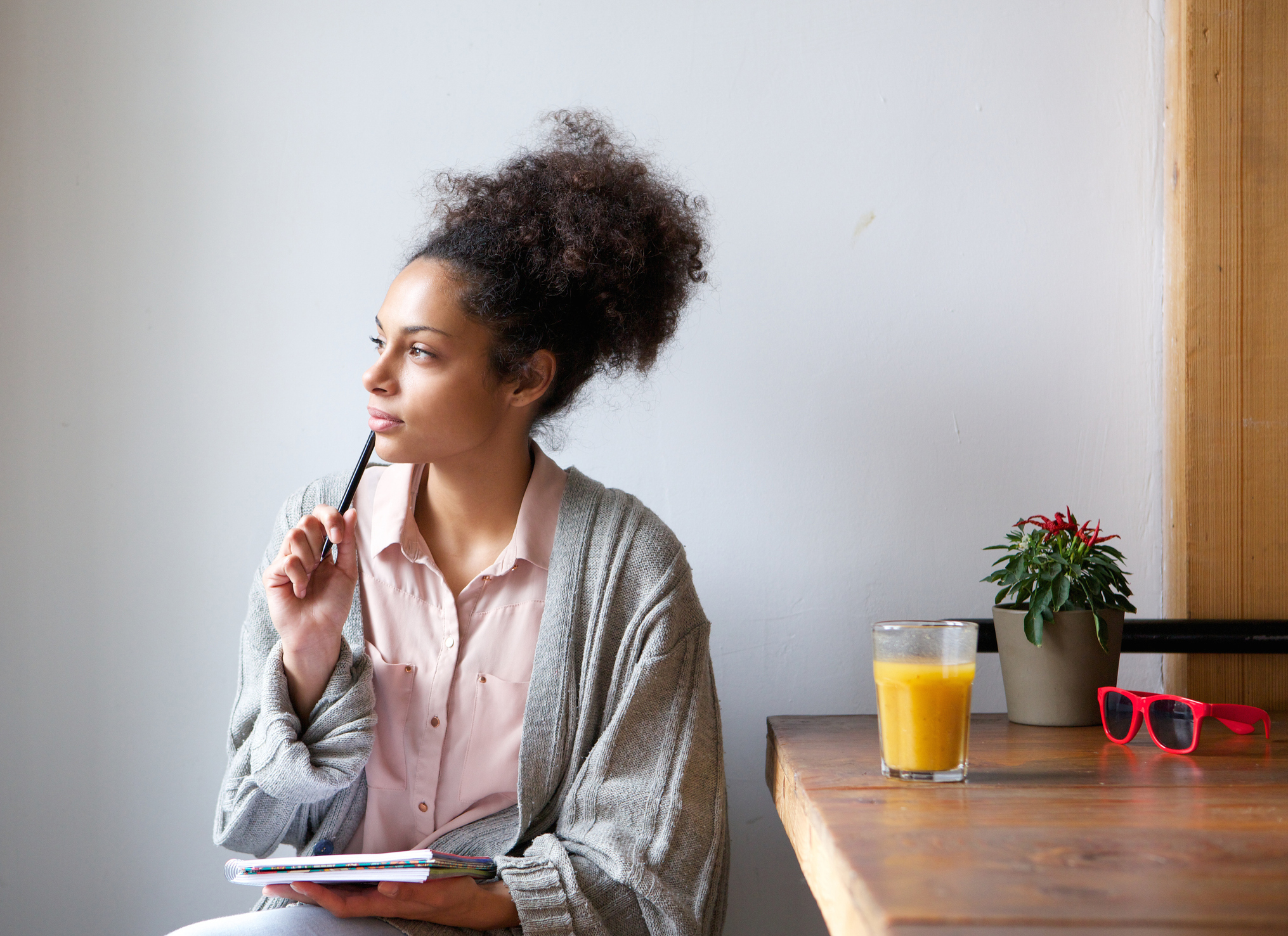 Young woman at home reflecting on her anxiety after her therapy session