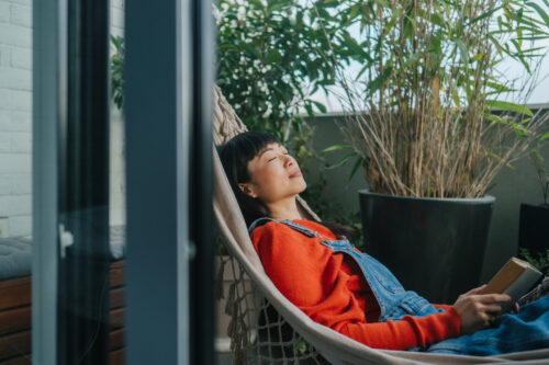 Woman feeling calm and reflecting on her progress in her opioid use disorder treatment