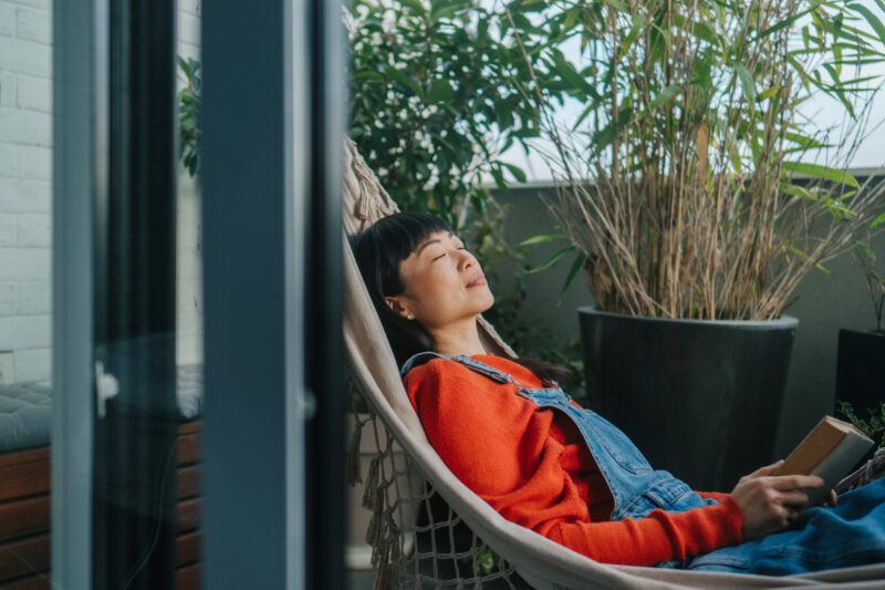 Woman feeling calm and reflecting on her progress in her opioid use disorder treatment
