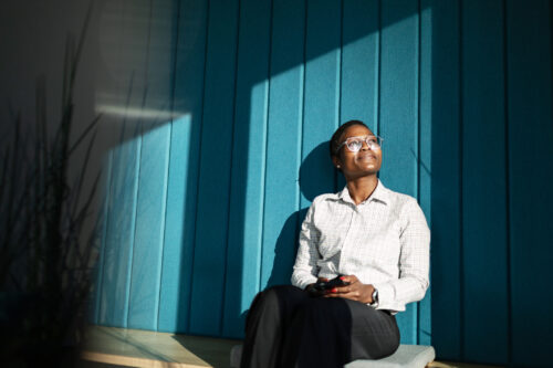Person feeling reflective of their gender identify journey and realizing the connection with their neurodivergence