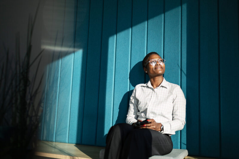 Person feeling reflective of their gender identify journey and realizing the connection with their neurodivergence
