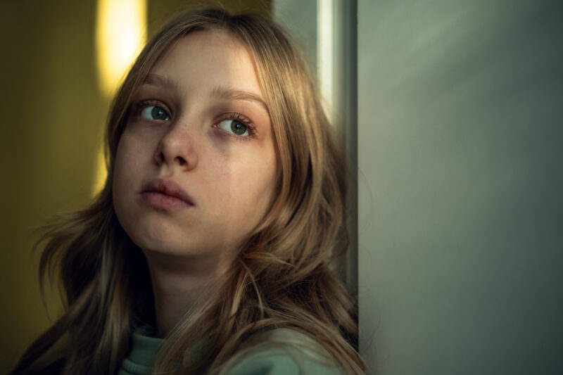 Girl by the door evokes emotional depth and introspection, could represent the “internal struggle” often associated with neurosis.
